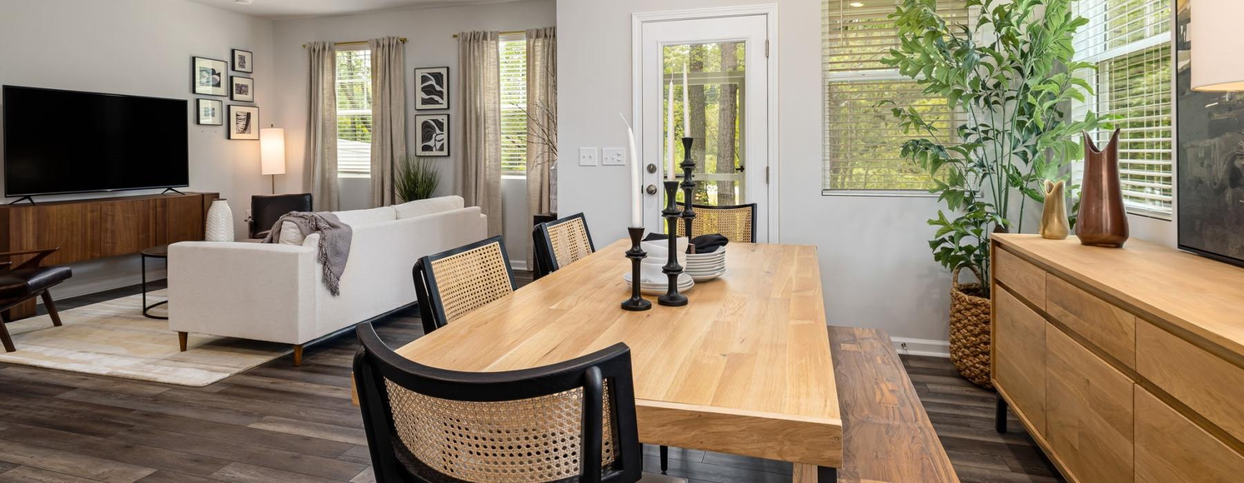 a large living room with a large table and chairs