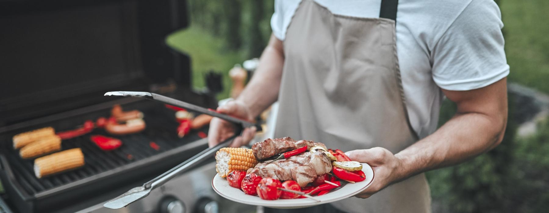 a man holding a plate of food