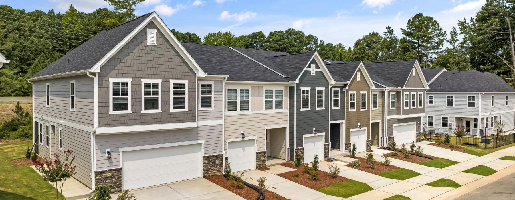 a row of apartments near trees